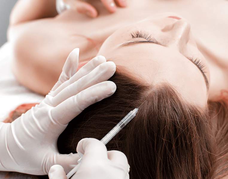 Woman undergoing GFC Therapy for hair loss problems in females