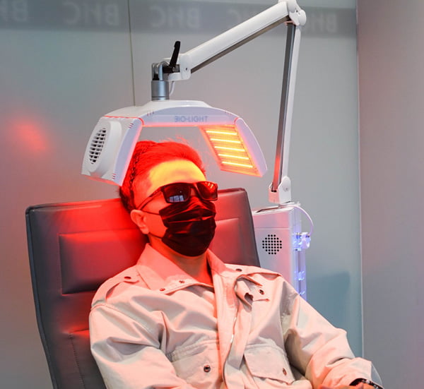 patient undergoing Low Level Laser Therapy(LLLT) Treatment for hair loss problem in hair clinic