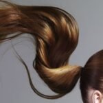 a woman with ponytail hair flying