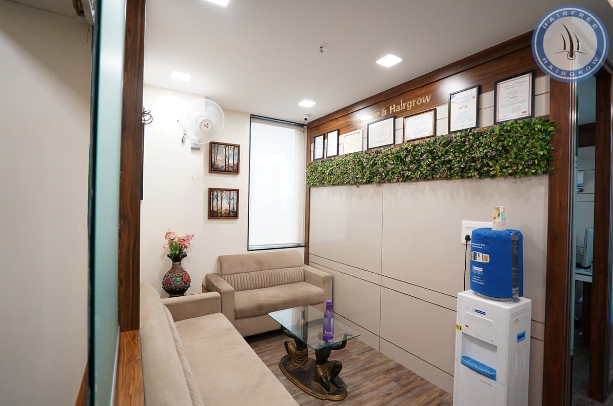 patient waiting area with sofa, fan and water filter system at kolkata branch of hair grow clinic