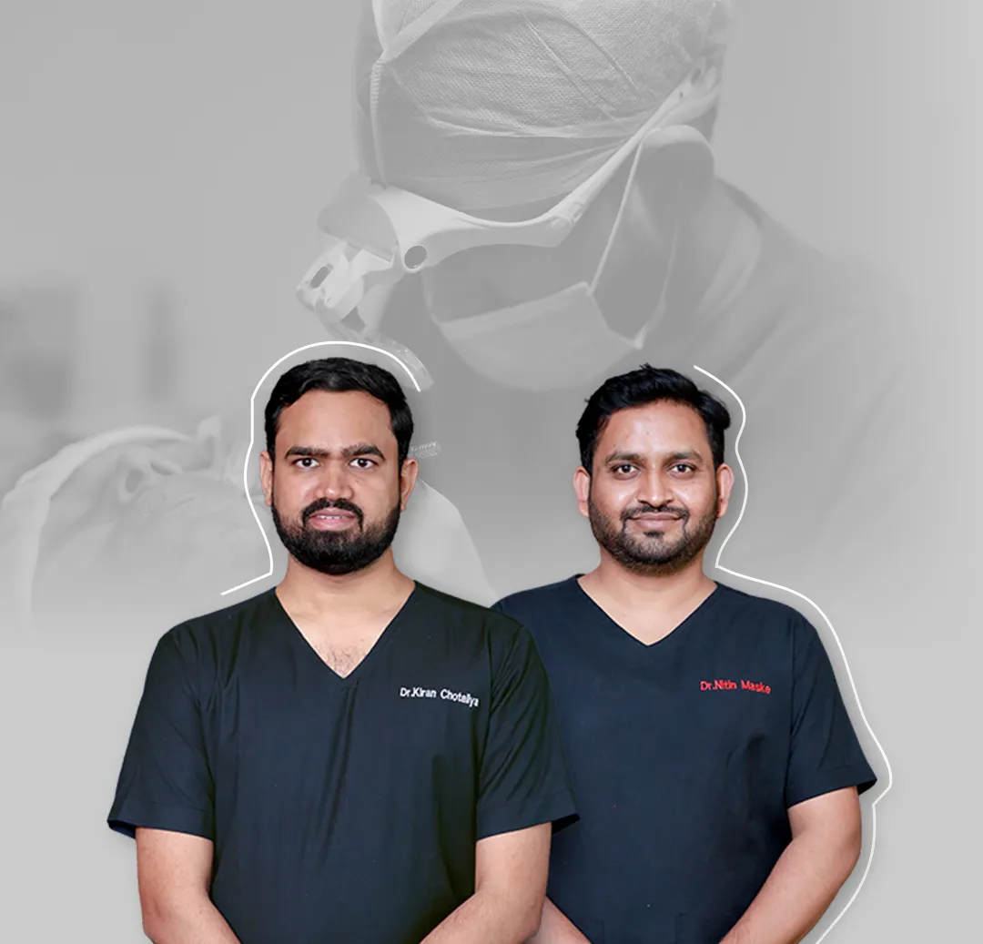 dr kiran chovatiya posing with other doctor at clinic for hair transplant pune