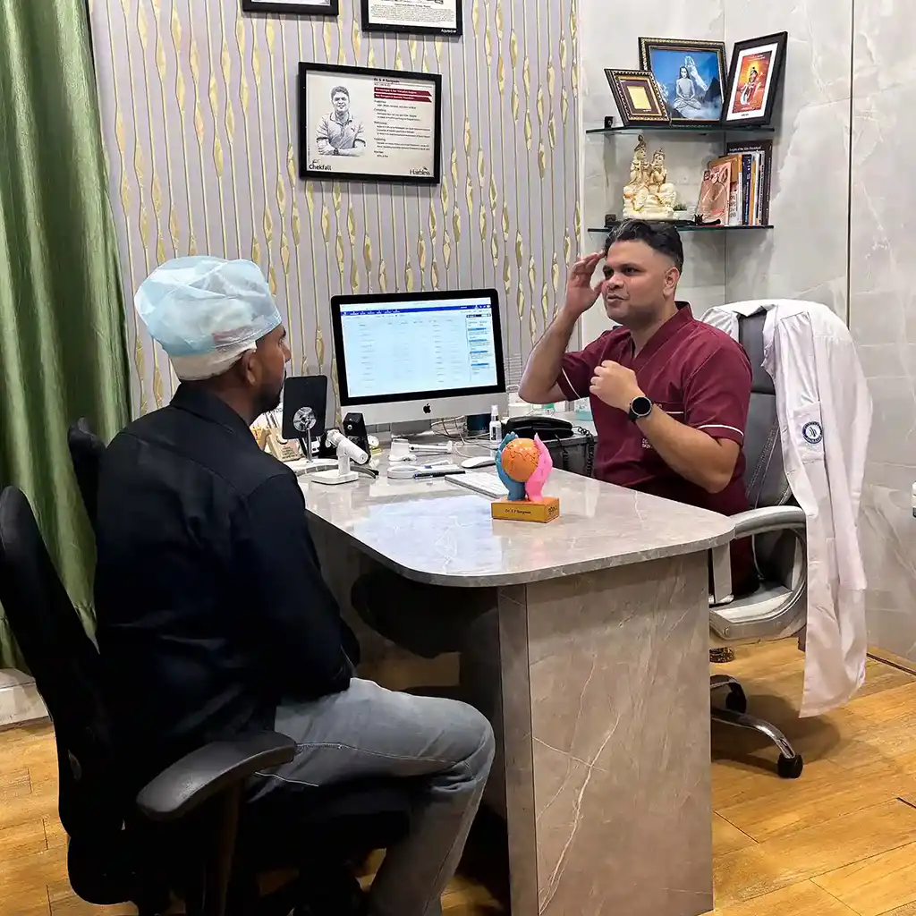 Hair Transplant Cost in agra consultation with doctor examining patient’s scalp