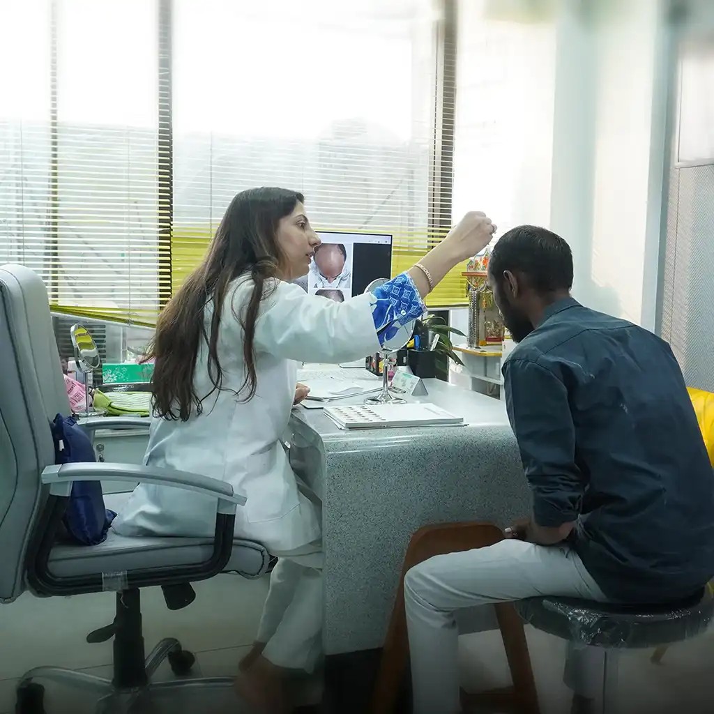 Hair Transplant Cost in Jodhpur consultation with doctor examining patient’s scalp