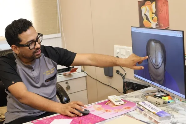 Hair transplant doctor at Hairfree Hairgrow explaining hairline design and graft planning during consultation
