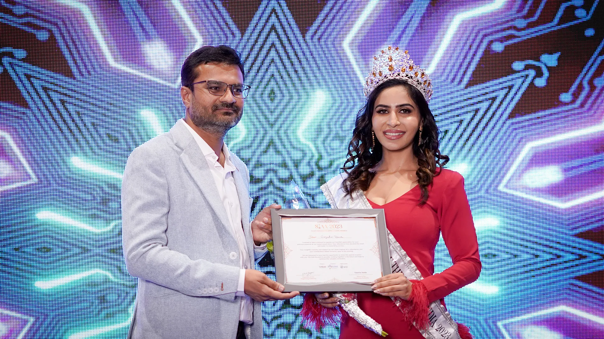 Hairfree Hairgrow representative receiving a certificate of recognition at an award ceremony